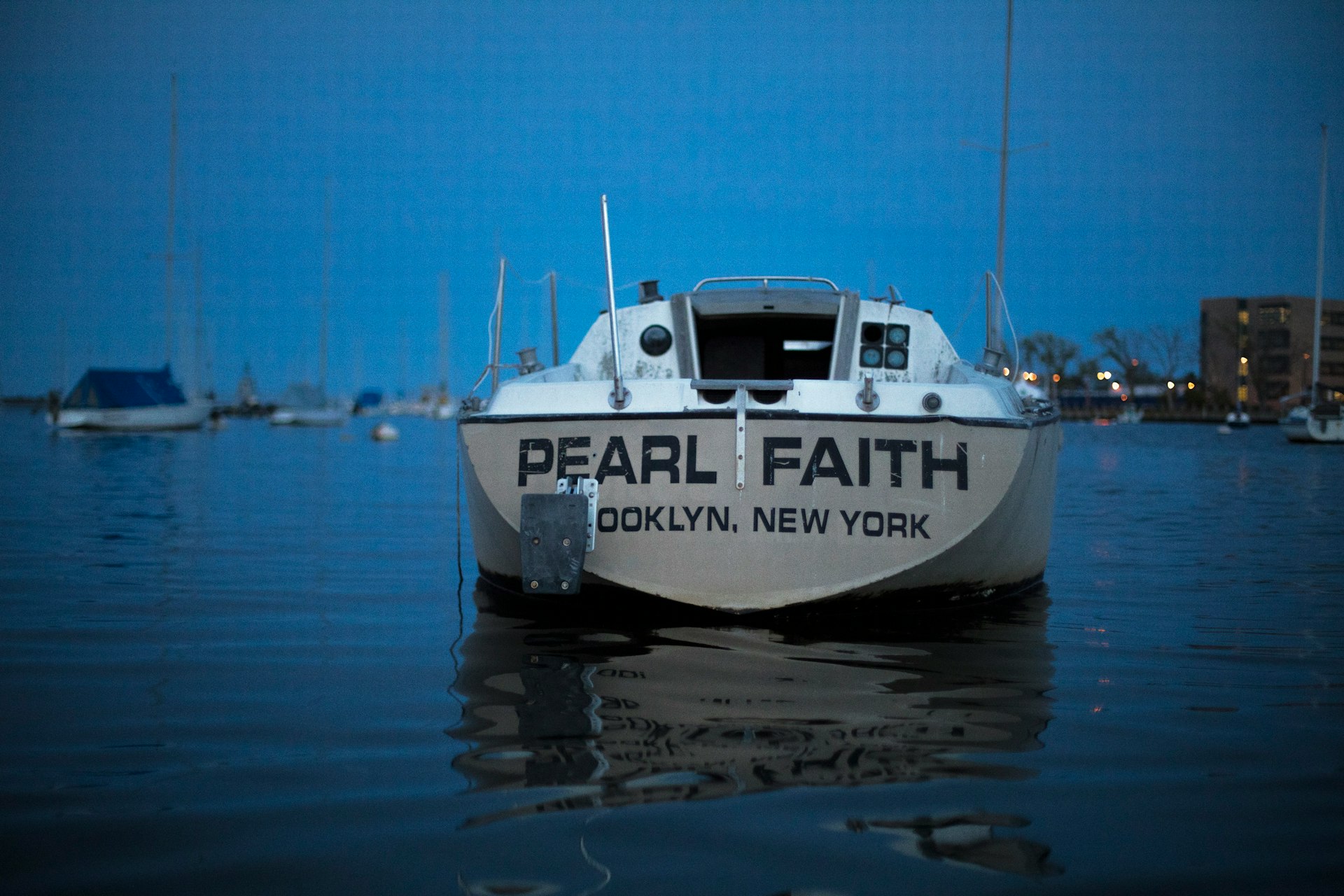 white speed boat on bod of water